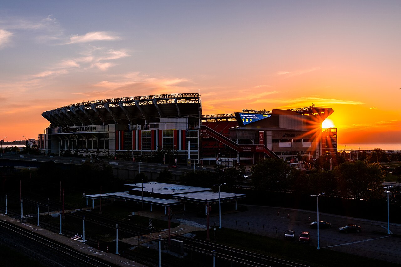 The Cleveland Browns' lakefront stadium beneath an orange sunset in May 2020.
